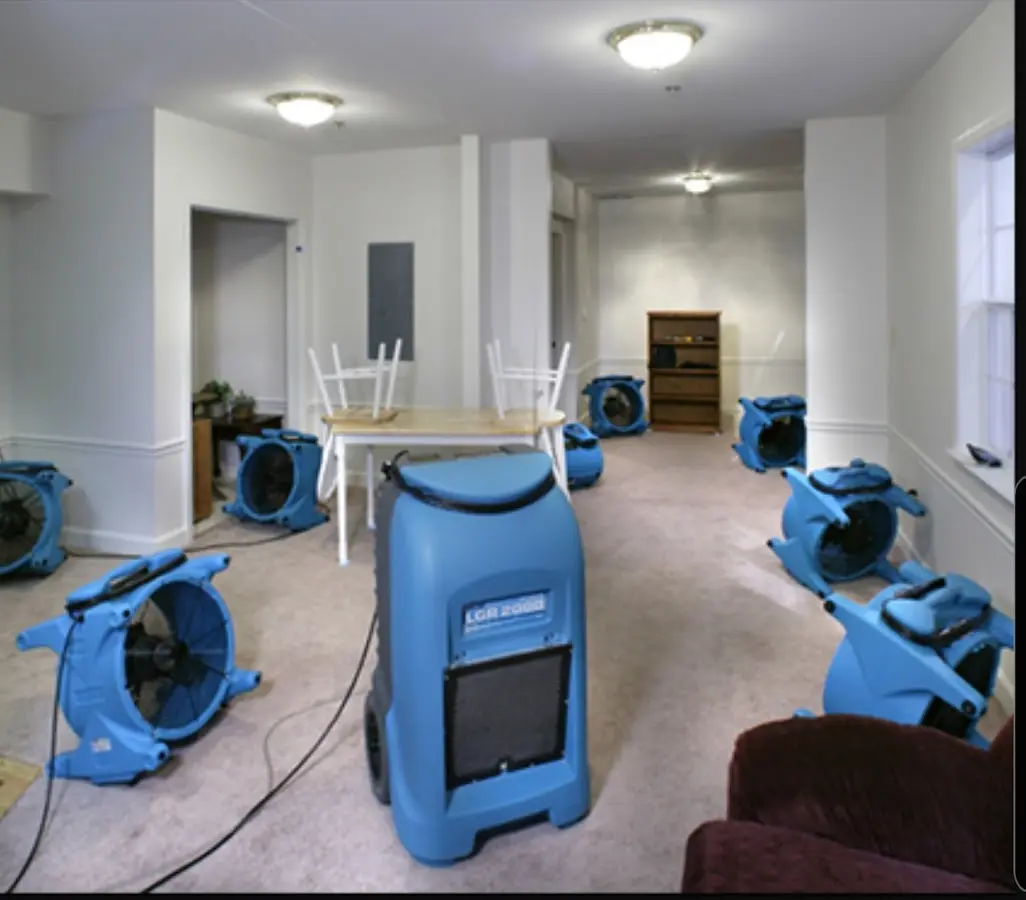 Air movers and dehumidifier setup for Water Damage Restoration in Plains